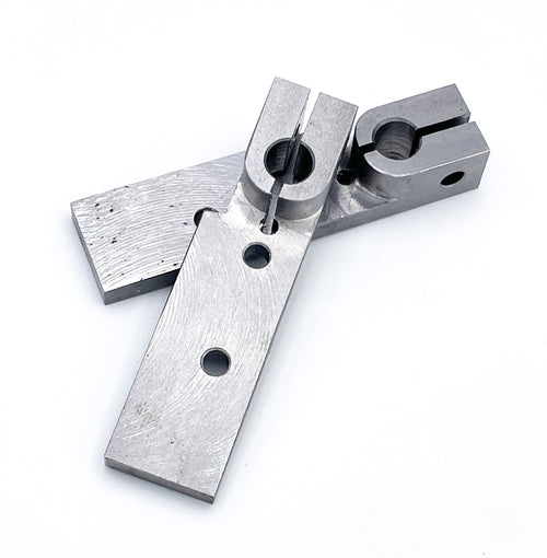 A standard base plate for a tattoo machine, made of precision milled low carbon steel, displayed on a white background.